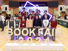 Teacher-Librarian Ms. WONG Mei-ying (front row left four) and School Librarian Ms. WONG Wan-yin (front row right three) with the Library Service Team