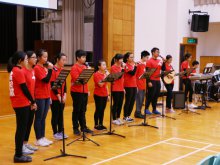 Christian Worship Group leading teachers and students to sing hymns