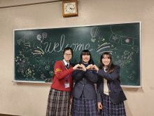 CHAN Man-ching (left one) visiting a Japanese school
