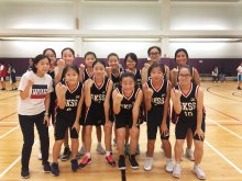 Ms. LUK Kwok-mun (Front left one) taking photo with the basketball team after the competition
