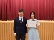 Principal Mr. HO Chun-yan (left) congratulating Chan Suet-ching Eunice