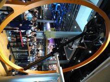 Students on the 360° bicycle at the Shenzhen Longgang Science & Technology Museum, experiencing inverted positions in a zero-gravity state like astronauts in space