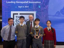 The guest (middle) and Geography subject head teacher Mr. PANG Ying-wai taking a photo with the student awardees: (from left two) LAM Lok-hin from 4R, NG Kwan-yu from 4I and WONG Sum-yi from 4S