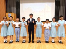 Principal Mr. HO Chun-yan posing for a photo with S.1 class representatives