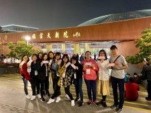 Mr. KWAN Yuk-lun and students in front of the National Centre for Performing Arts