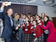 The Secretary for the Environment Mr. WONG Kam-sing, GBS, JP taking a selfie with all guests and members of the school cheerfully