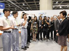 Participating students displaying Sign-translate Gloves to Mrs. Carrie LAM Cheng Yuet-ngor, GBS, Chief Executive of HKSAR