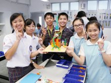 Students from Santa Laurensia High School participating in the Project Learning lesson, using Lego to construct models of buildings in both places with Sun Kei students
